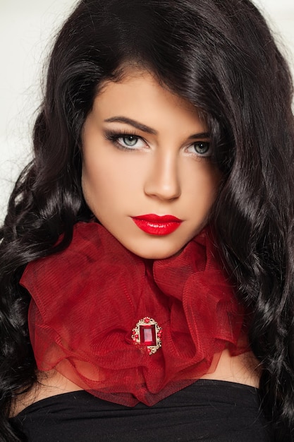 Gorgeous Brunette Woman in Red Fashion Collar Fashion Portrait of Brunette Hair Model