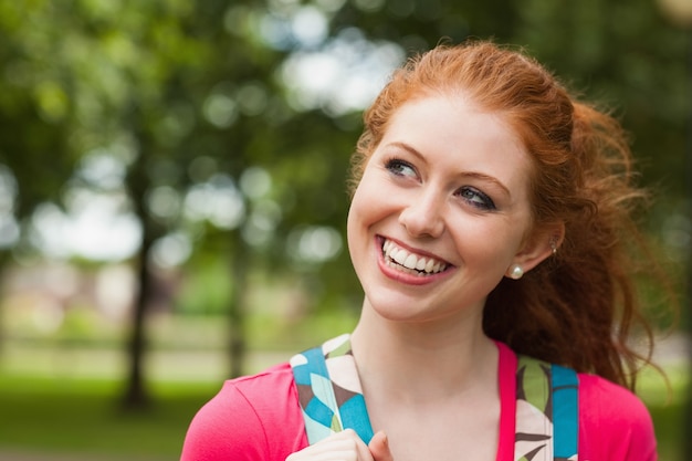 Gorgeous cheerful student looking up