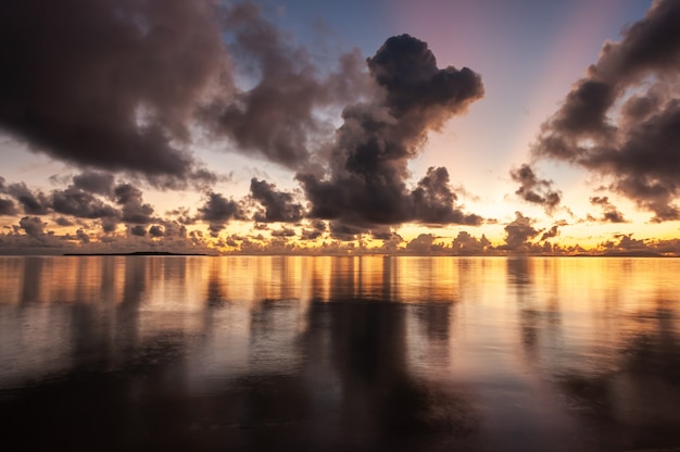 Gorgeous colorful ocean sunrise with dynamic clouds over sky Iriomote Island