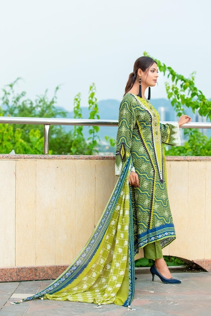 Gorgeous Girl Side Pose with Attitude Wearing Green Dress for Fashion Photoshoot