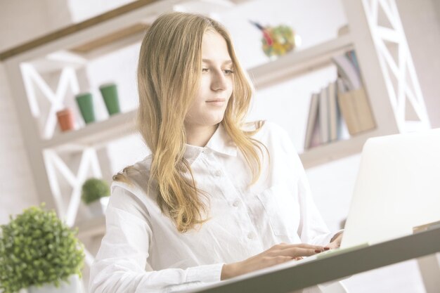 Gorgeous girl using laptop