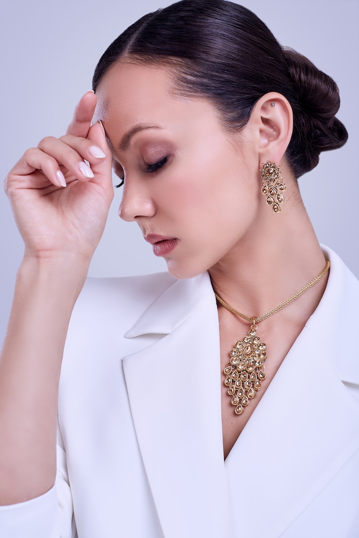 Gorgeous latin women in fashion white suit wearing expensive jewelry