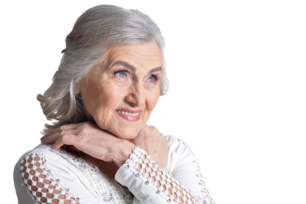 Gorgeous mature woman posing on white background