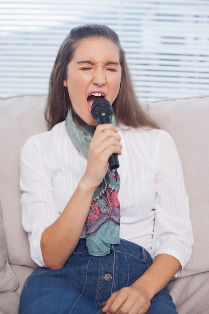 Gorgeous model singing on microphone