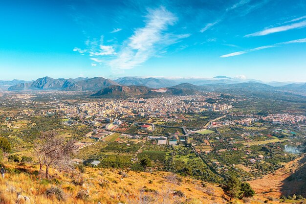 Gorgeous morning cityscape of bagheria town and national park orientata pizzo cane