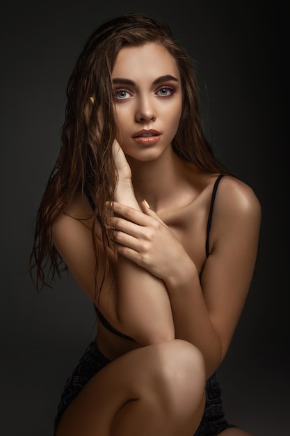 Gorgeous sexy woman with perfect skin and long wet hair