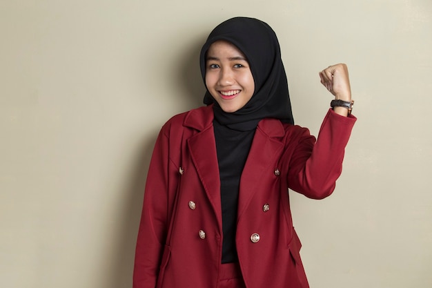 Gorgeous strong young asian business woman wearing hijab