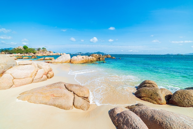 Gorgeous tropical beach turquoise transparent water unique rock boulders