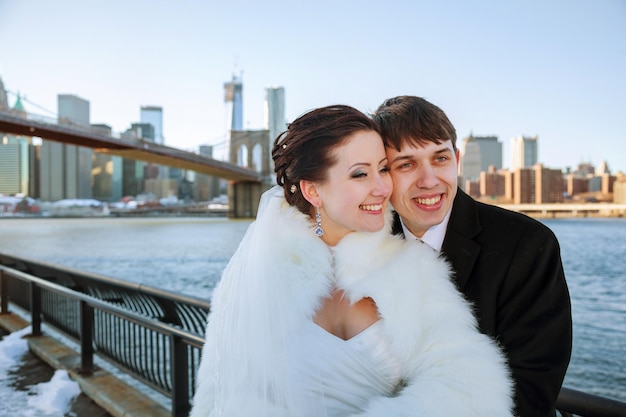 Gorgeous wedding couple bride and groom posing on bridge in Krakow