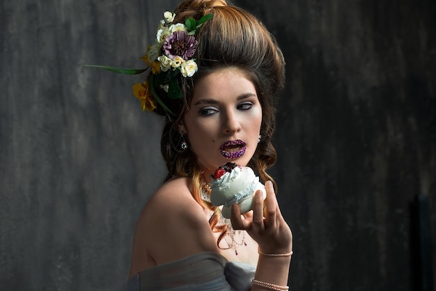 Gorgeous woman with cake for concept design Beauty portrait