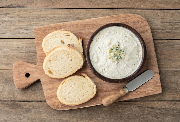 Gorgonzola cheese dip with sliced bread Blue cheese cream