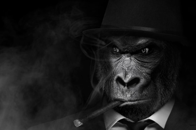 A gorilla smoking a cigar in a suit and hat