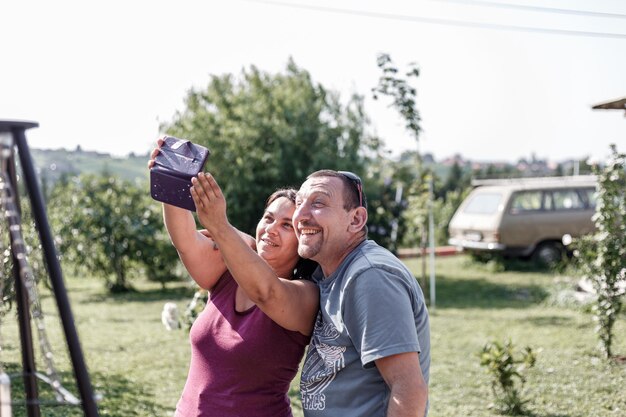 Gornja Radgona Slovenia August 8th 2020 A woman and a man taking a selfie on a smartphone outsi