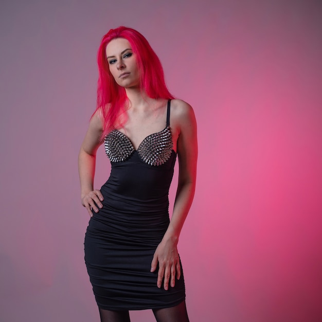 Goth sexy look young attractive woman with pink hair