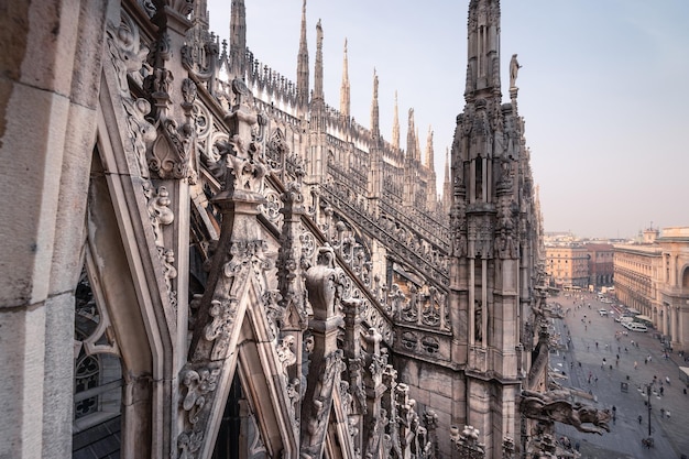 Gothic Architectural details on roof of Milan Duomo catholic cathedral in morning light Milan Italy