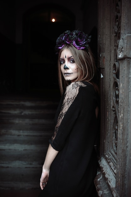 Gothic woman posing at door