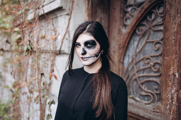 gothic young woman in  halloween costume 