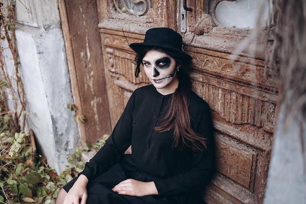 gothic young woman in  halloween costume 