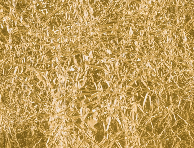 Foto goud gekreukeld papier textuur abstracte achtergrond