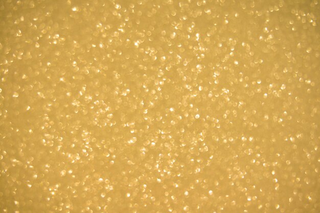 Goud glitters achtergrond glinsterende vervaging spotlichten Bokeh Glanzende gouden lichte achtergrond