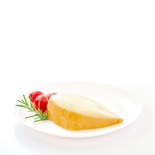 Gouda cheese with rosemary and tomatoes