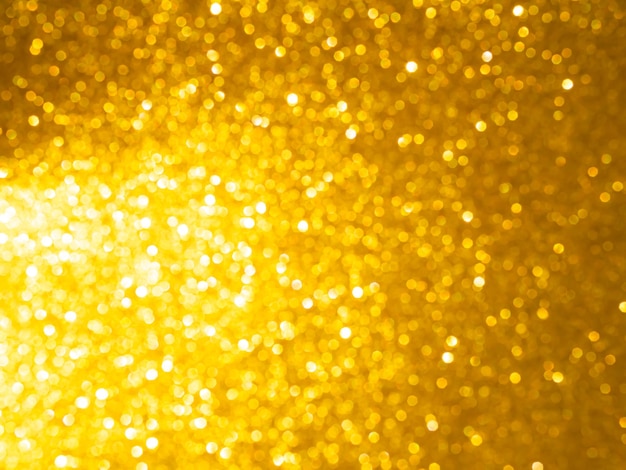 Gouden achtergrond Glitter Bokeh Lightfor CelebrationTexture Foil Gouden kleurAbstract behang voor feestdagen Kerstmis Gelukkig Nieuwjaar vonkpatroon Gele heldere effect kaart Luxe achtergrond