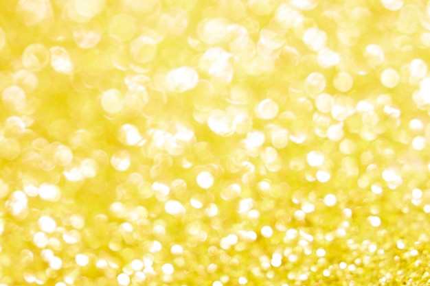 Gouden bokeh textuur. Feestelijke glitter achtergrond met onscherpe lichten.