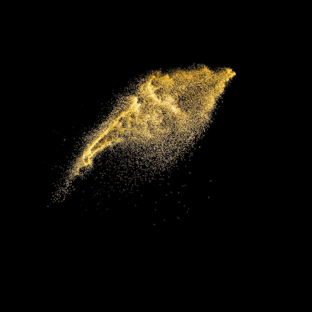 Gouden gekleurde zandplons tegen donkere achtergrond. De gele golf van de zandvlieg in de lucht.