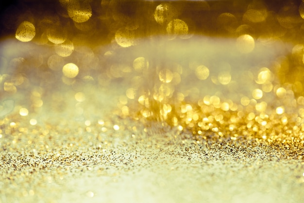 Foto gouden glitter bokeh verlichting textuur wazig abstracte achtergrond