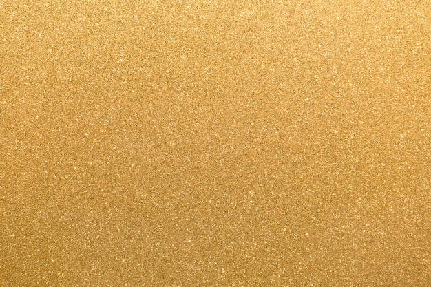 Gouden glitter oranjegeel oppervlak met knipperende witte onregelmatige vlekken achtergrond.