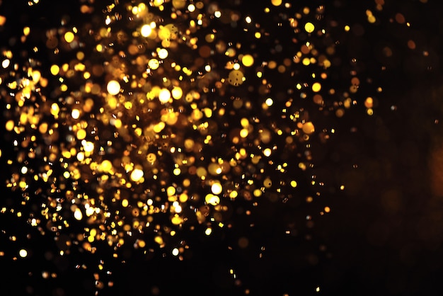 Gouden glitter textuur Colorfull Wazig abstracte achtergrond voor verjaardag nieuwe jaar vooravond of Kerstmis