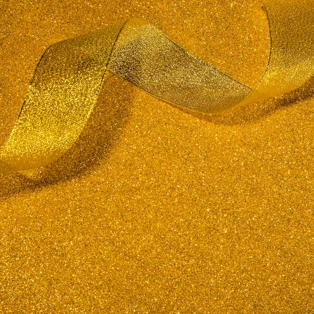 Foto gouden glitterlint met kopie ruimte