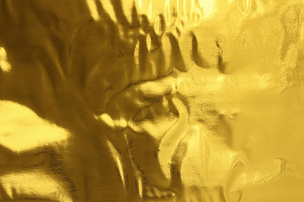 Foto gouden textuur achtergrondfolie verfrommeld goud