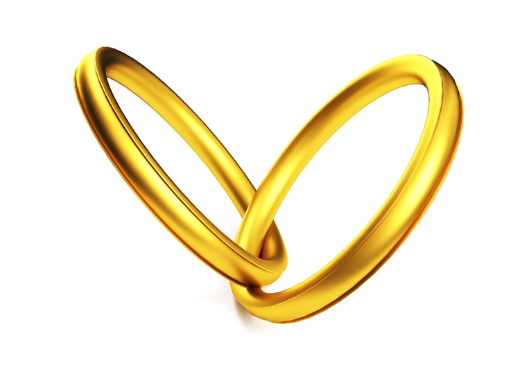 Foto gouden trouwringen gekoppeld in de vorm van hart geïsoleerd op een witte achtergrond. 3d-weergave.