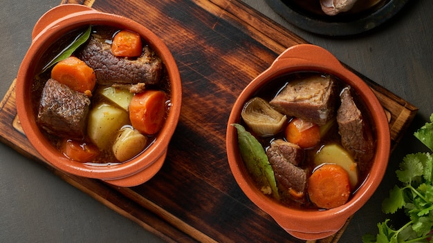 Goulash with large pieces of beef and vegetables.