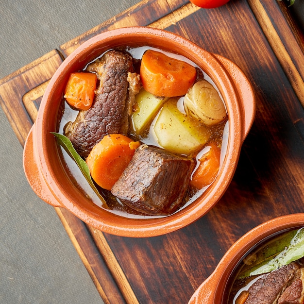 Goulash with large pieces of beef and vegetables.