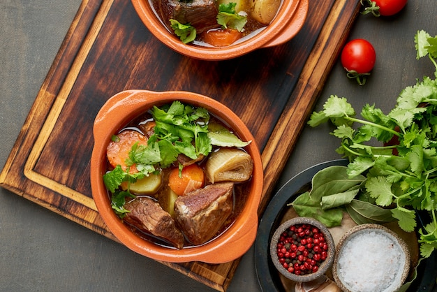 Photo goulash with large pieces of beef and vegetables.