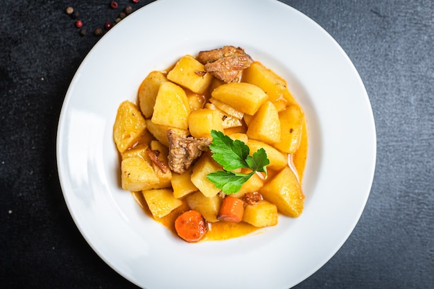 goulash with potatoes and meat stewed vegetables and pork