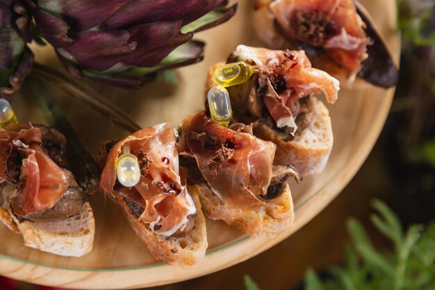 Gourmet buffet meals toast with smoked ham loin soaked in olive oil charcuterie