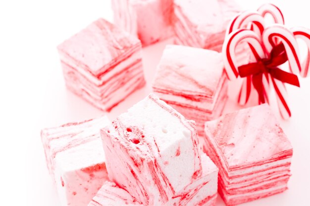 Gourmet candy-cane marshmallows on a white background.