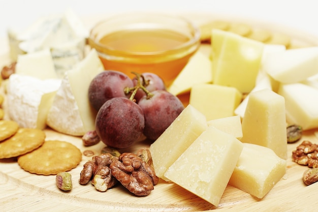 Gourmet cheese, set on wooden board