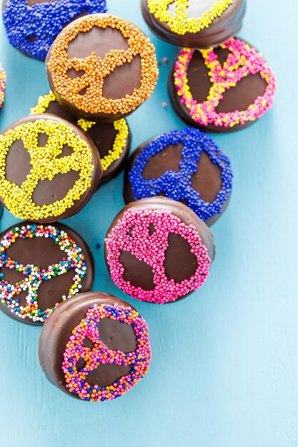 Gourmet Chocolate covered Oreos with colorful sprinkles on top.