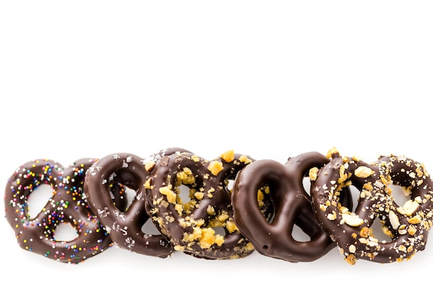 Gourmet chocolate covered pretzels on a white background.