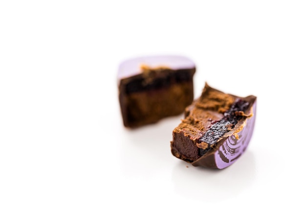 Gourmet chocolate truffles on a white background.