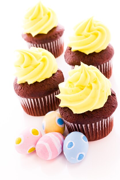 Gourmet cupcakes with yellow icing prepared for Easter.