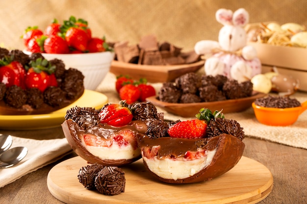 Gourmet easter egg, stuffed with chocolate and strawberry. Easter egg with pudding cream, Easter dessert. Easter concept.