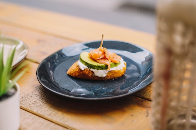 Gourmet fresh cheese avocado and salmon canapes