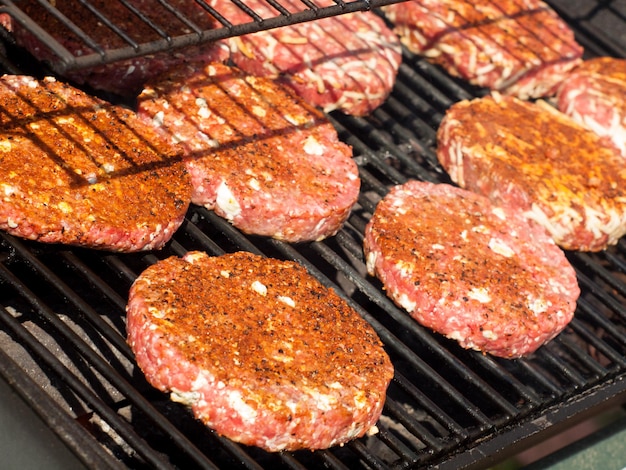 Gourmet hamburger parries on the grill