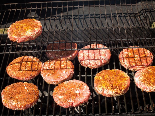 Gourmet hamburger parries on the grill.