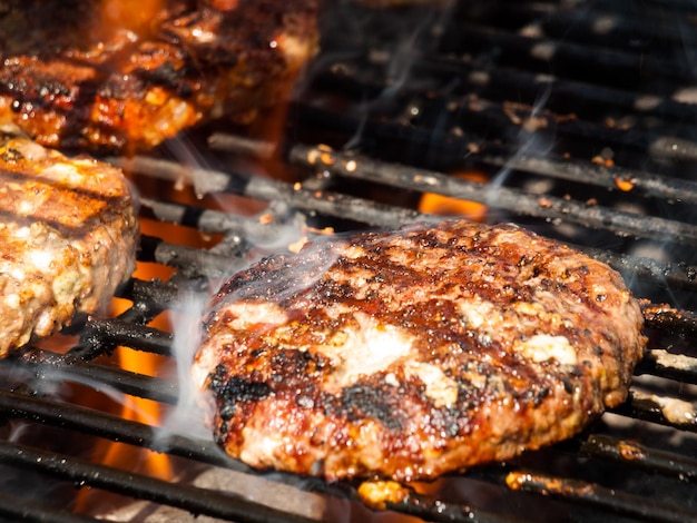 Gourmet hamburger parries on the grill.